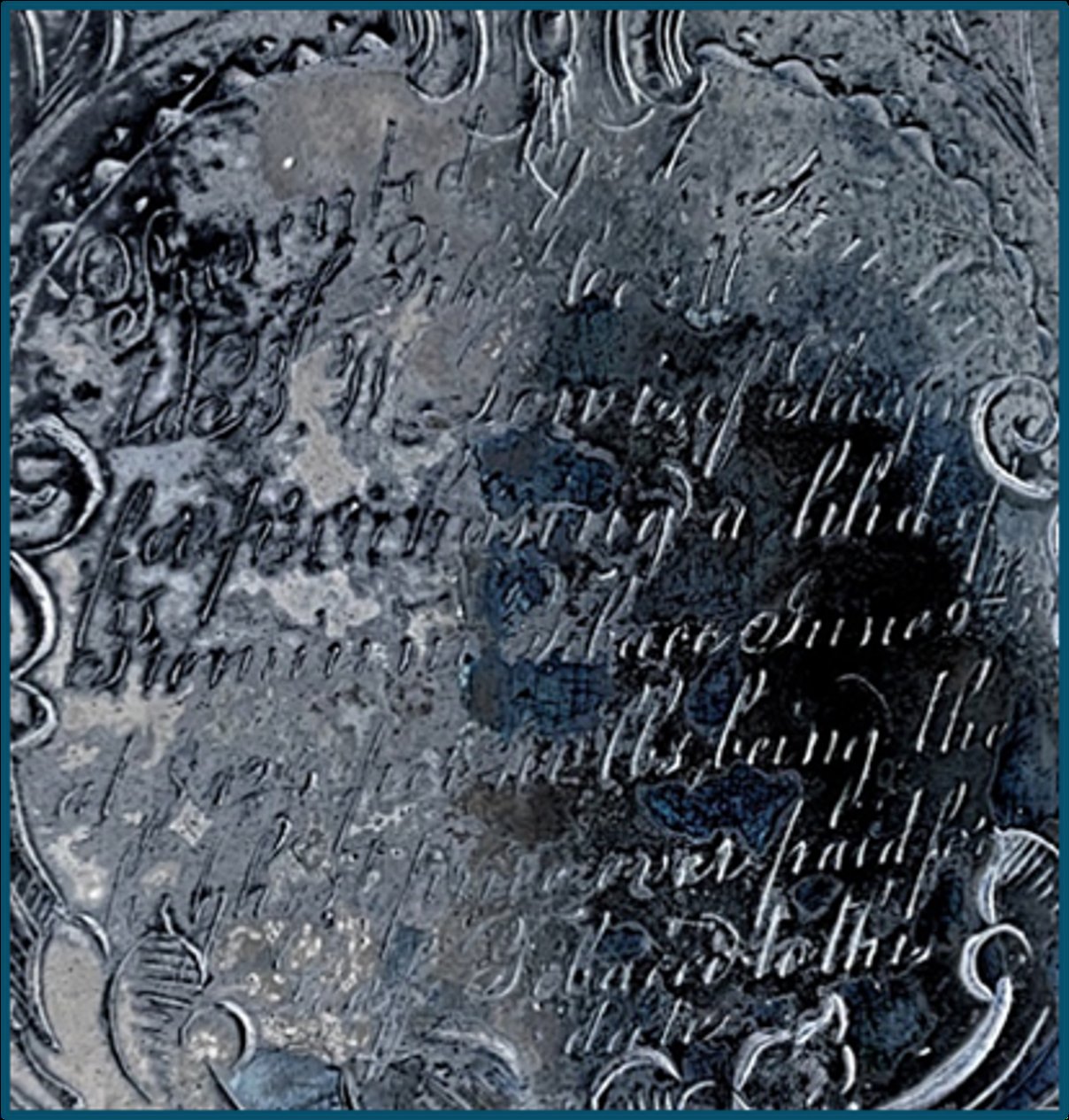 Close-up of the engraved silver inscription